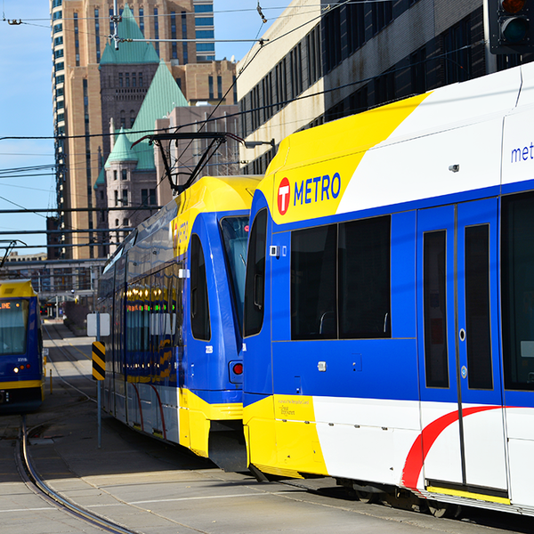Two trains on the light rail transit system runs through the center of downtown Minneapolis