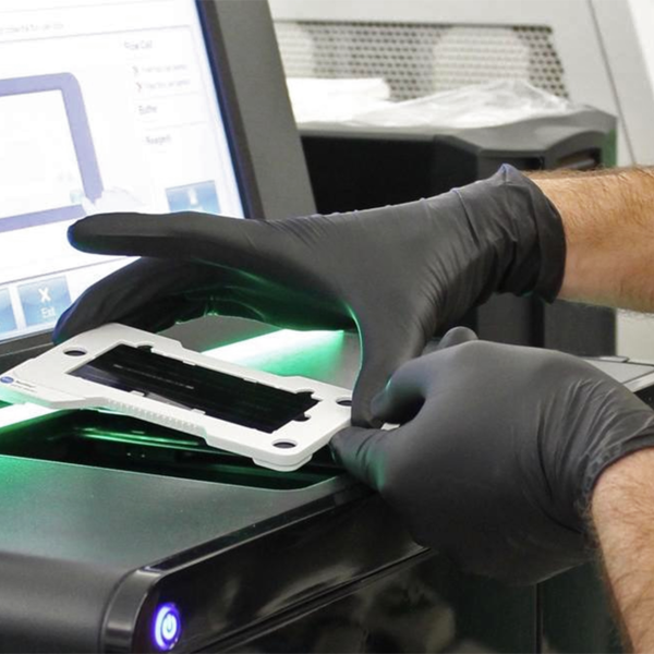 A sample being place into next-generation sequencing equipment in the UMGC lab